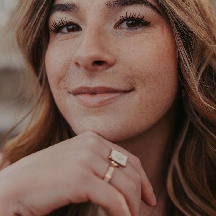 Kaveri Mehta, Lead Design Curator at Bridge Canyo Nember, reviewing corporate floral arrangements